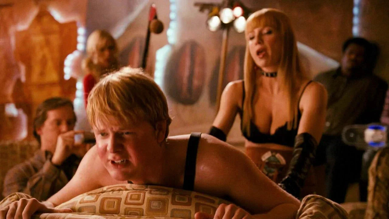 a woman is trying pegging with a man